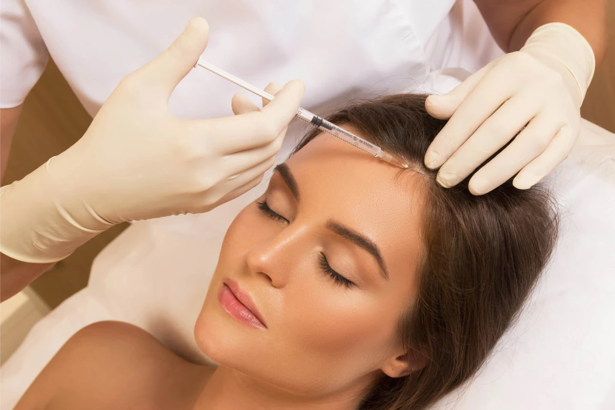 Woman receiving Keravive Treatment in Morristown, TN for scalp hydration and hair restoration